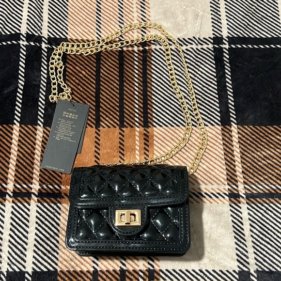 Forever 21 Handbags - Mini black quilted gold chain purse!